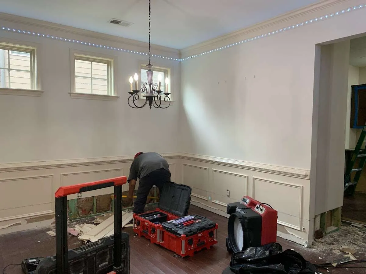 Restoration technician with professional equipment in Stone Mountain